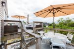 Upper deck, out door seating and dining area with umbrella